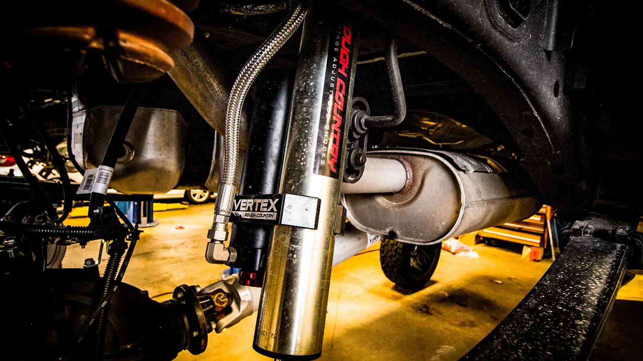 A Rough Country leveling and lift kit laid out before installation at Apple Off Road.