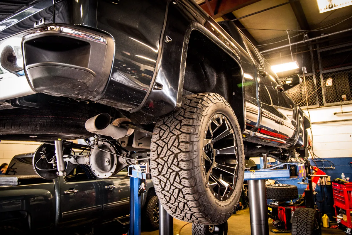 A truck up on the in-house alignment rack inside the Apple Off Road shop.